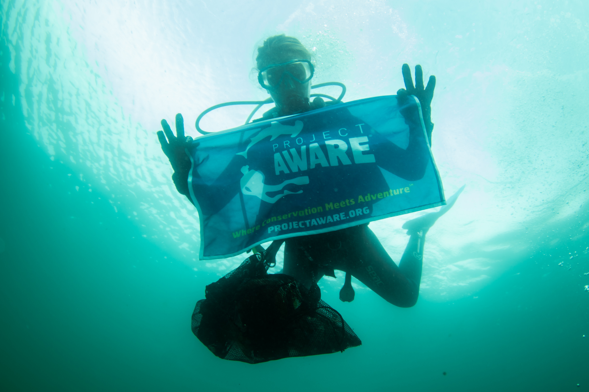 image of dive against debris bag and flag