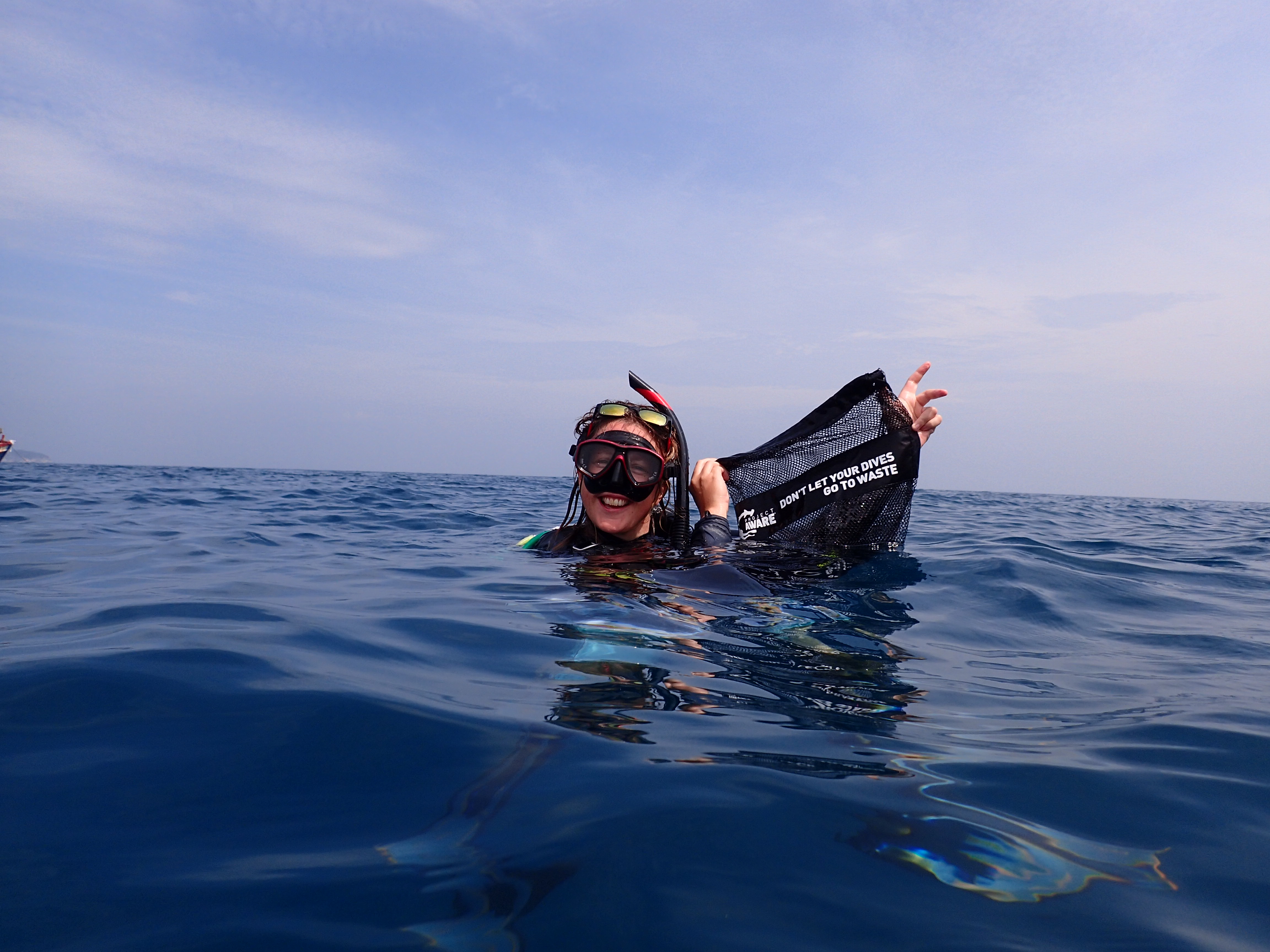 Nic Emery with DAD bag in ocean