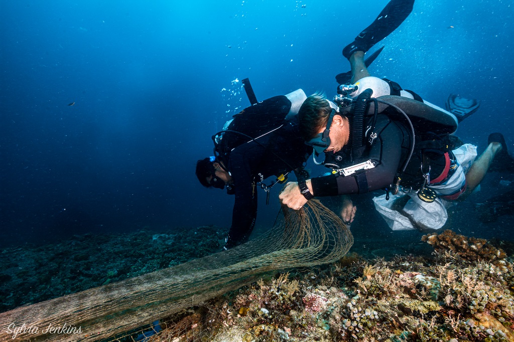 image of divers and ghost net malapascua