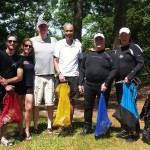 Seven volunteer divers line up for a group photo after the cleanup!