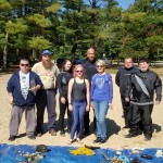 The seven divers and shore support line up behind the trash collected underwater!